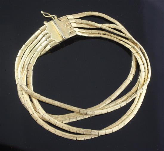 An Italian textured 18ct gold multi strand bracelet, approx. 18.3cm.